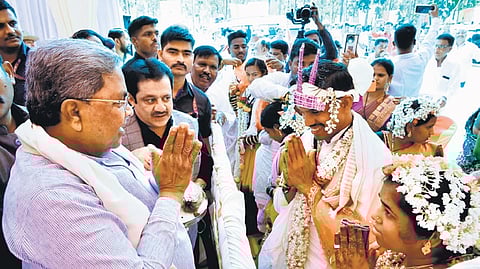 Chief Minister Siddaramaiah wishes newly-weds at a mass marriage event held in Vijayanagara district on Sunday.