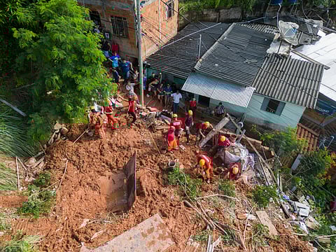 Aerial view of rescue teams working on a landslide site at Bethania neighborhood, Ipatinga, Minas Gerais state, Brazil