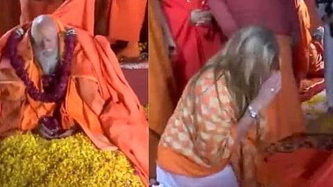 Member of the Niranjani Akhara and renamed as Kamala, Laurene was dressed in a long white apparel combined with an orange shawl while performing the ritual.
