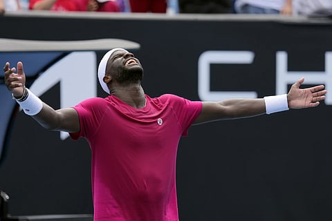 Frances Tiafoe of the US celebrates after defeating Arthur Rinderknech of France in the first round match at the Australian Open tennis championship at Melbourne, Australia, Monday, Jan 13, 2025