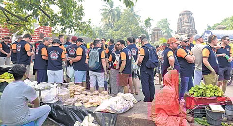 Foreign tourists standing in a queue in front of Lingaraj temple | SHAMIM QURESHY