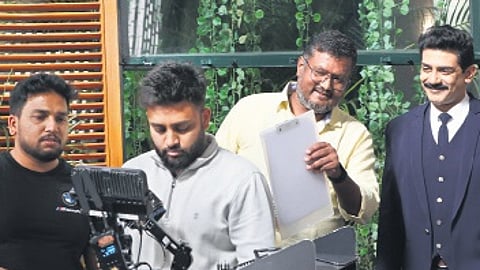 Dinakar Thoogudeepa along with the crew on the sets of Royal