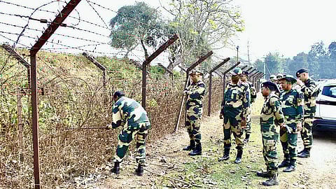 Border Security Force (BSF) officials inspect the Single Row Fencing (SRF) at the Kathalchari Border Outpost area in Tripura.