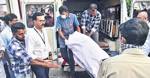 Gopan Swami’s body being brought to NIMS Hospital mortuary after a postmortem examination at the Thiruvananthapuram Medical College Hospital.