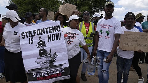 Families of miners and activist protest as South Africa's Police minister Senzo Mchunu visit an abandoned gold mine, where miners are rescued from below ground in an abandoned gold mine in Stilfontein, South Africa, Tuesday, Jan 14, 2025.