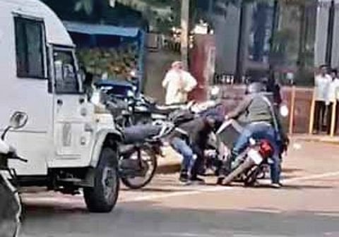 A screengrab of masked men fleeing with the cash box after a robbery in Bidar on Thursday;