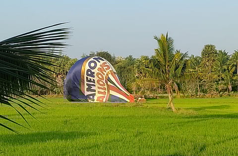 A balloon gets deviated from its path for consecutive days at Pollachi during the International Balloon Festival on Thursday.