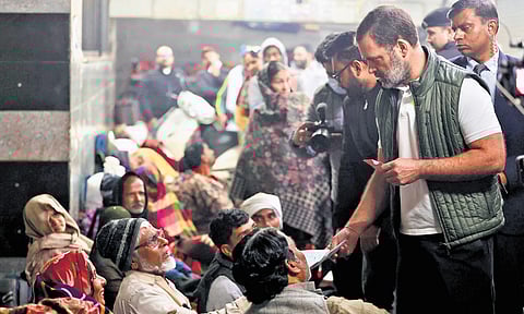 Leader Of Opposition in the Lok Sabha Rahul Gandhi interacts with patients and their families waiting for treatment outside AIIMS.