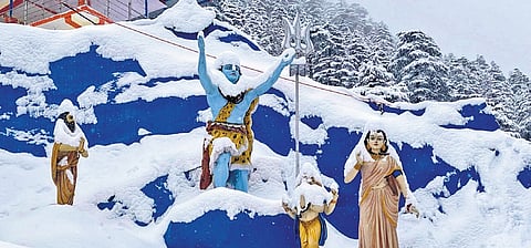 After fresh snowfall, a village temple in Uttarkashi district lies snow covered.