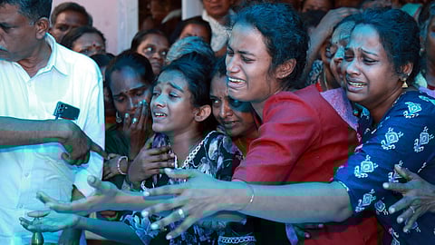 Visnishas Daughter and Sister Nitha weeps in the public view of the victims who lost lives in a gruesome murder at Chendamangalam