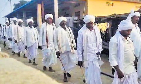 As part of the Nagoba jatara, members of the Meshram clan walk from Keslapur to Hasanmadugu in Jannaram mandal to fetch holy water from Godavari river
