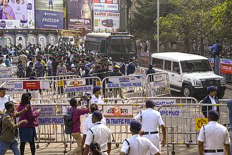 Police personnel keep vigil as Sanjay Roy, accused in the alleged rape and murder of an on-duty doctor at R G Kar Medical College and Hospital, is brought to the Sealdah court in police vehicle on the day of the verdict, in Kolkata, Saturday, Jan. 18, 2025.