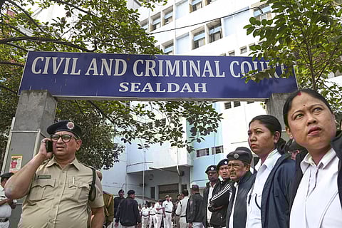 Police personnel keep vigil outside the Sealdah court where the judgement in the alleged rape and murder of an on-duty doctor at R G Kar Medical College and Hospital is scheduled to be delivered, in Kolkata, Saturday, Jan. 18, 2025.