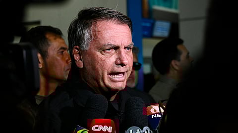 Former Brazilian President Jair Bolsonaro speaks to members of the media at Brasilia airport on January 18, 2025.