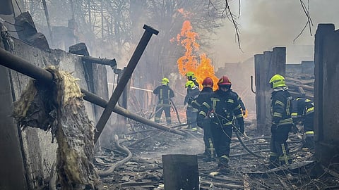 File photo of firefighters after a missile attack in Kyiv.