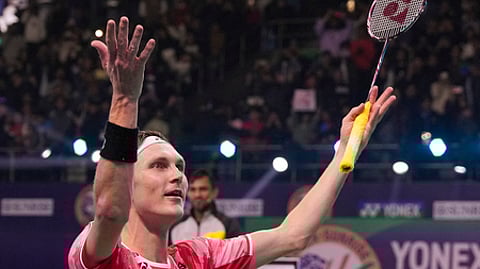 Denmark's Viktor Axelsen celebrates after winning the men's badminton singles final