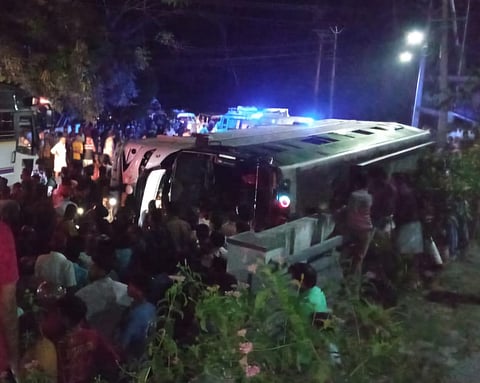The tourist bus overturned in Irinchayam near Nedumangad in Thiruvananthapuram on Friday night.