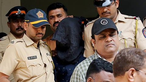 Police personnel with the accused, arrested in connection with the alleged attack on Bollywood actor Saif Ali Khan