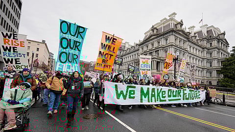 People march in the People's March, Saturday, Jan. 18, 2025, in Washington.