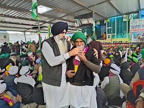 A group of 121 farmers end their fast by sipping juice in the presence of Deputy Inspector General of Police Mandeep Sidhu and Patiala Senior Superintendent of Police Nanak Singh.