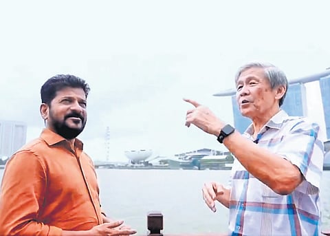 An official explains the features of riverfront development projects as Chief Minister A Revanth Reddy takes a boat ride on the Singapore River during his tour of the city-state on Sunday