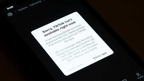 A message reading "Sorry, TikTok isn't available right now" is displayed from the TikTok app on a cell phone screen on Saturday.