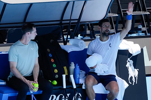 Novak Djokovic (right) with Andy Murray at a practice session in Melbourne