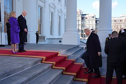 President Joe Biden, center left, and first lady Jill Biden, left, greet President-elect Donald Trump, center right, and Melania Trump, right, upon arriving at the White House, Monday, Jan. 20, 2025, in Washington.