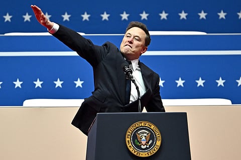Tesla and SpaceX CEO Elon Musk gestures as he speaks during the inaugural parade inside Capitol One Arena, in Washington, DC, on January 20, 2025.