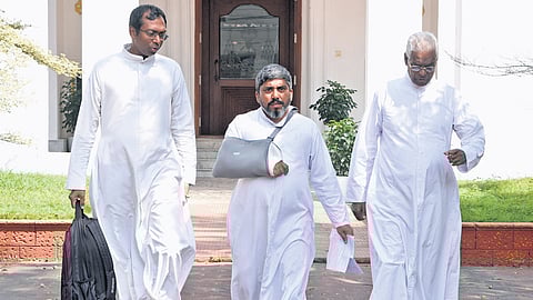 Priests leaving after a discussion with Archbishop Mar Joseph Pamplany at the
Bishop House in Kochi