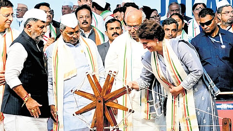 Wayanad MP Priyanka Gandhi spins a charkha to inaugurate Congress’ Jai Bapu, Jai Bhim, Jai Samvidhan rally, as AICC president Mallikarjun Kharge, CM Siddaramaiah, DCM DK Shivakumar, and other leaders look on, in Belagavi on Tuesday