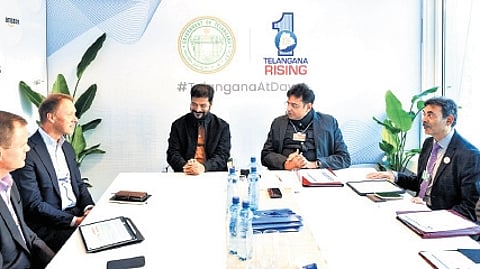 Chief Minister A Revanth Reddy and IT & Industries Minister D Sridhar Babu with Unilever CEO Hein Schumacher during the Davos World Economic Forum on Tuesday