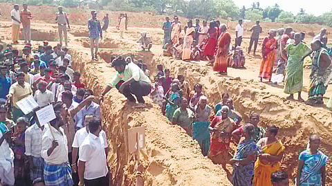 A file picture of villagers staging a protest at the construction site of Vadalur Vallalar centre