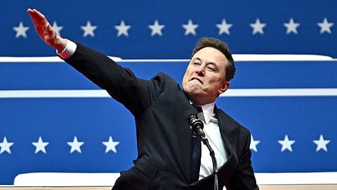 Tesla and SpaceX CEO Elon Musk gestures as he speaks during the inaugural parade inside Capitol One Arena, in Washington, DC, on January 20, 2025.