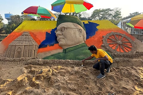 A sand art on Netaji in progress at the Satyabrata Stadium