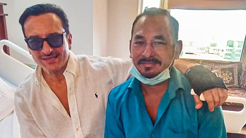 Bollywood actor Saif Ali Khan is seen with auto-rickshaw driver Bhajan Singh Rana, who rushed him to hospital after he was injured in a knife attack at his home, at the Lilavati Hospital before getting discharged, in Mumbai.