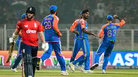 India's Arshdeep Singh, center, celebrates with teammates after taking the wicket of England�s Ben Duckett during the first T20I cricket match of a series between India and England, at the Eden Gardens, in Kolkata.