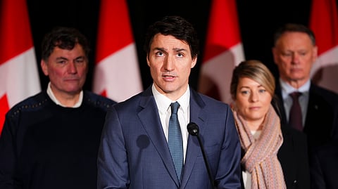 Canadian Prime Minister Justin Trudeau is joined by Minister of Finance Dominic LeBlanc, back left to right, Minister of Foreign Affairs Melanie Joly, Minister of Public Safety David McGuinty, as he holds a press conference during a cabinet retreat at Chateau Montebello in Montebello, Tuesday.