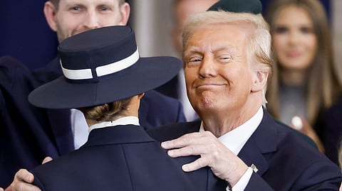 President Donald Trump enbraces his wife, first lady Melania Trump, after taking the oath of office during the 60th Presidential Inauguration in the Rotunda of the U.S. Capitol in Washington, Monday, Jan. 20, 2025.