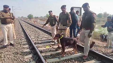Police personnel during inspection of tracks a day after a train mishap, in Jalgaon district, Maharashtra.