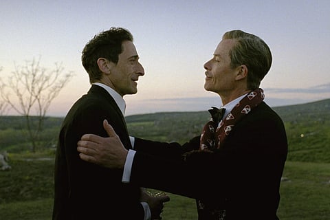 This image released by A24 shows Adrien Brody, left, and Guy Pearce in a scene from "The Brutalist"