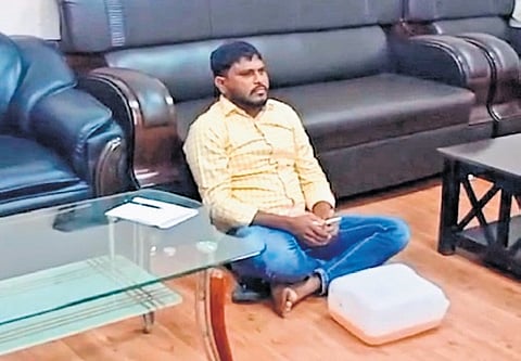 A KU student protests in the Vice Chancellor’s office on Thursday