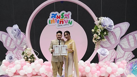 A couple from the LGBTQ+ community shows their marriage certificate in Bangkok, Thailand, Thursday, Jan. 23, 2025.