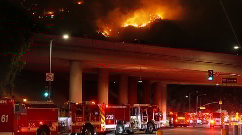 Apparatus sits on Sepulveda Blvd. as fire burns along Interstate 405, Thursday, Jan. 23, 2025, in Los Angeles.