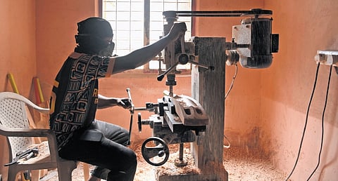Abbas scooping a bat at his workshop in Edappally. The final product comes out after careful chiselling and polishing