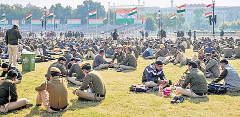 Police personnel take a break at Kartavya Path on sunny afternoon on Friday