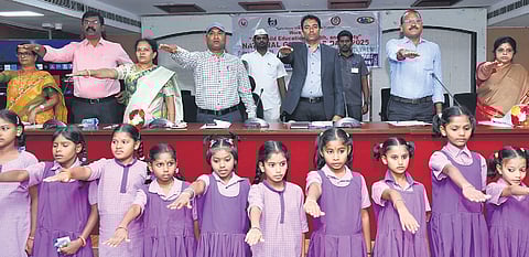 NTR District Collector G Lakshmisha and others taking a pledge on the occasion of National Girl Child Day in Vijayawada on Friday