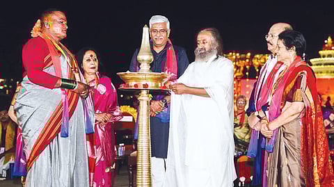 Art of Living Founder Sri Sri Ravi Shankar lights a lamp during ‘The Expressions Summit 2025-Bhaav’ in Bengaluru on Friday