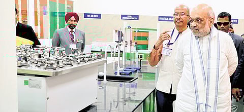 Amit Shah at Venkateshwara Cooperative soil and water testing lab in Nashik.
