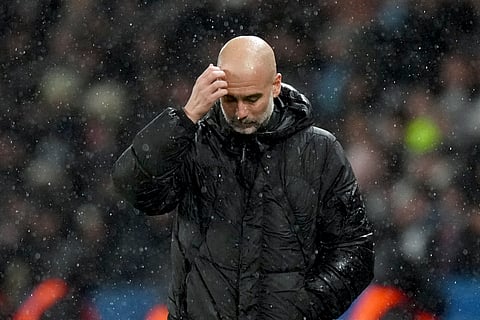 Manchester City's head coach Pep Guardiola reacts during a Champions League opening phase soccer match between Paris Saint-Germain and Manchester City at the Parc des Princes in Paris, Wednesday, Jan. 22, 2025.
